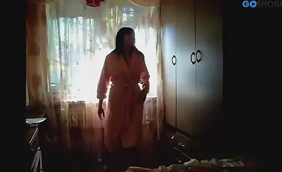 Brunette Teases in a Bathrobe